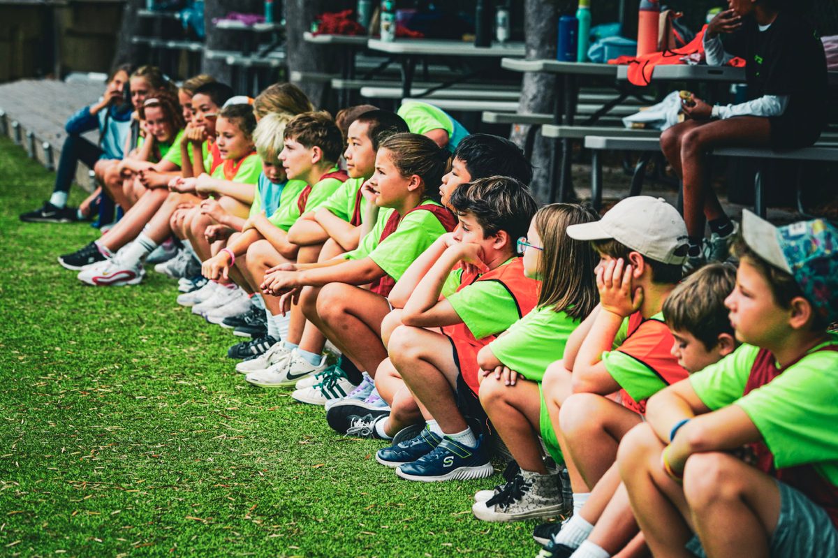 Camp kids watching from the sideline