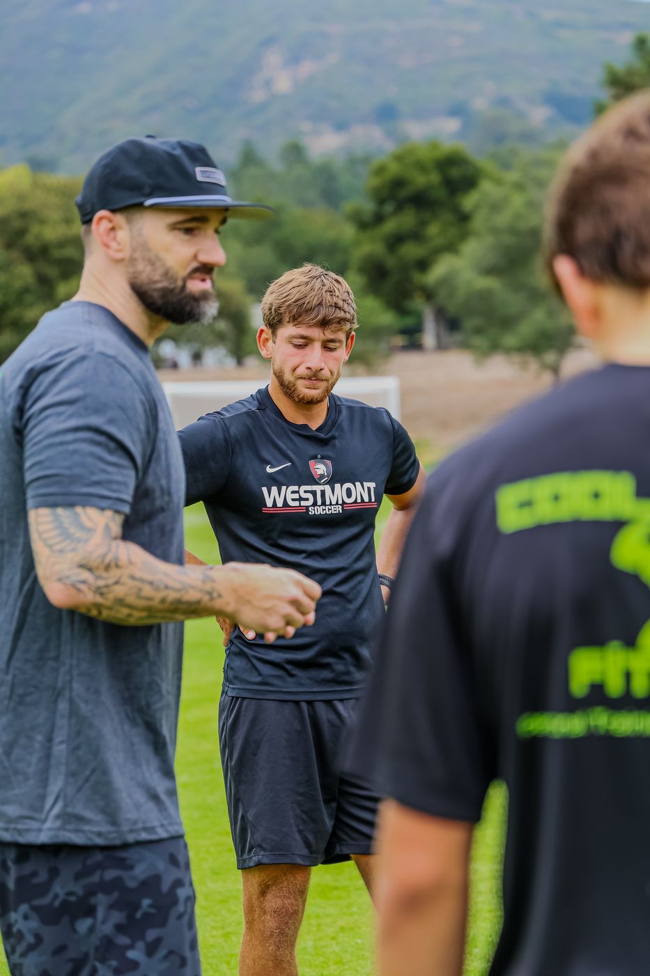 Coach Tovi instructing a young athlete